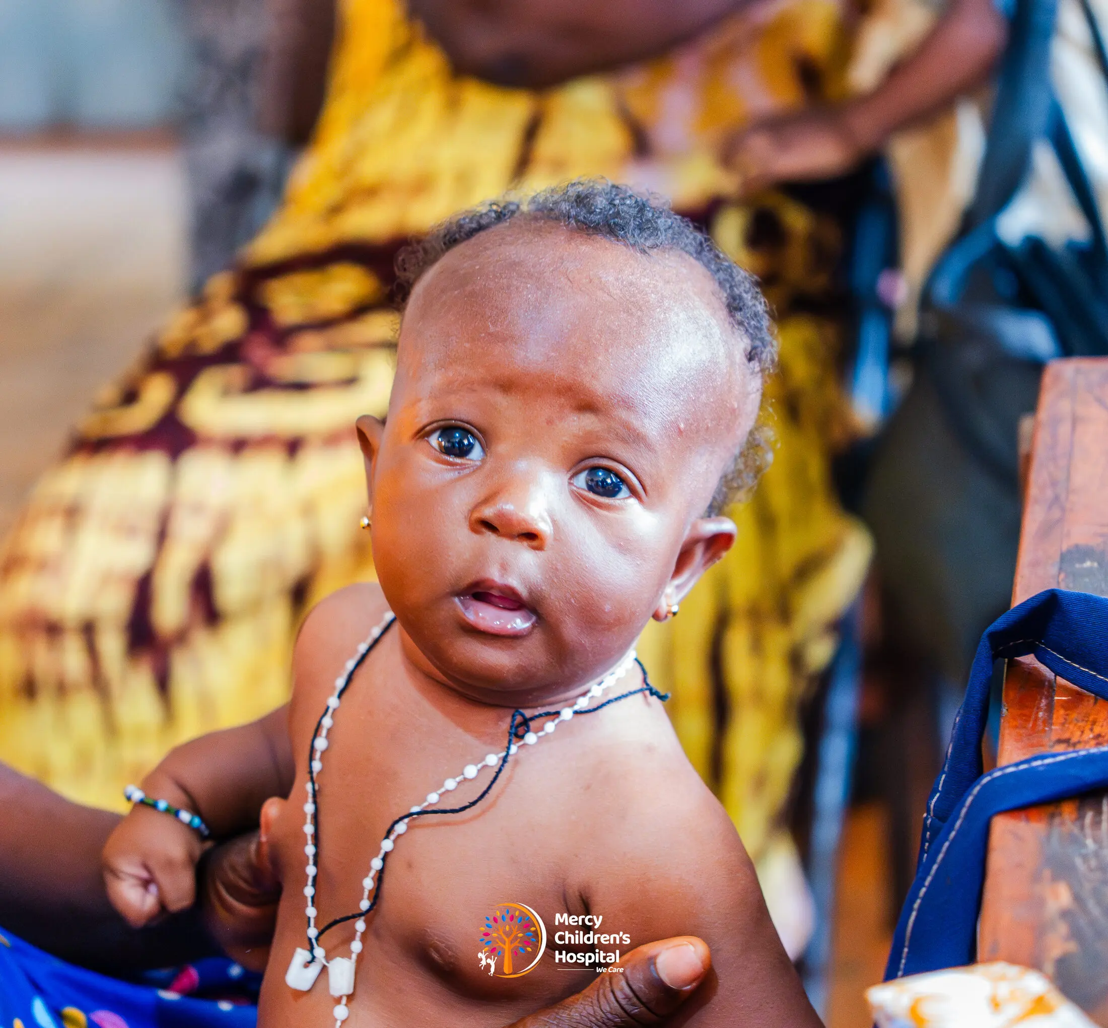 An infant looking at the camera