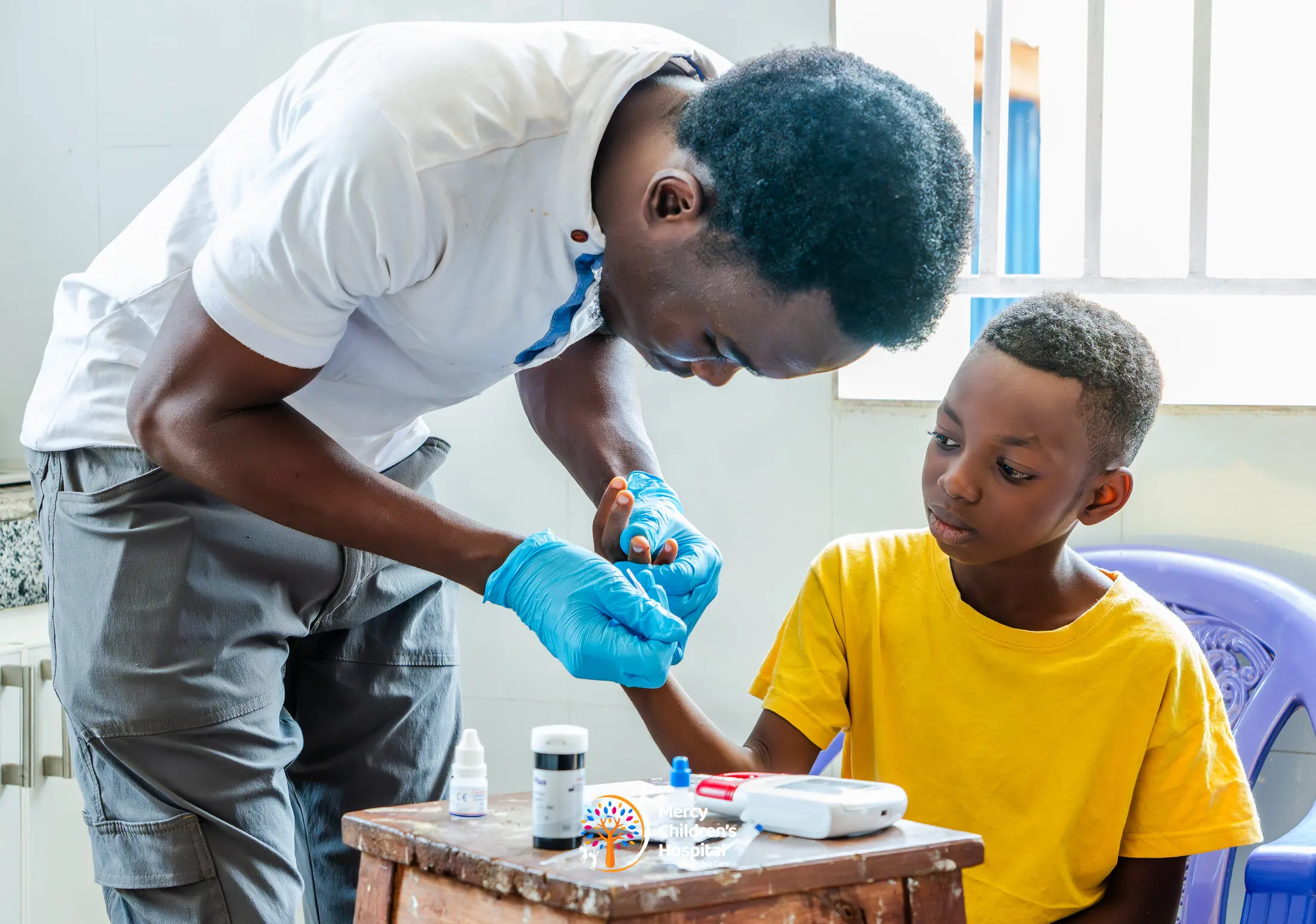 A health worker giving medicine to a child at a mission