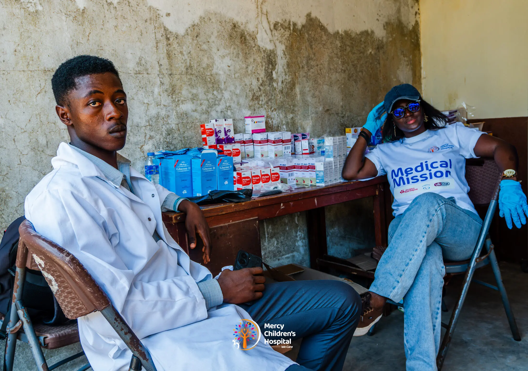 A table stocked with medicines at a mission site